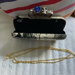 Snake Print Clutch with Skull Knuckle Duster